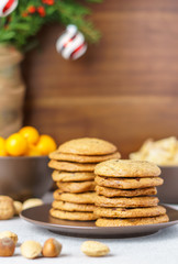 freshly baked chocolate chip cookies on a table with blurred background.