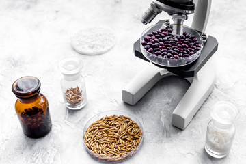 Fototapeta na wymiar Laboratory for food analysis. Red beans under the microscope on grey background