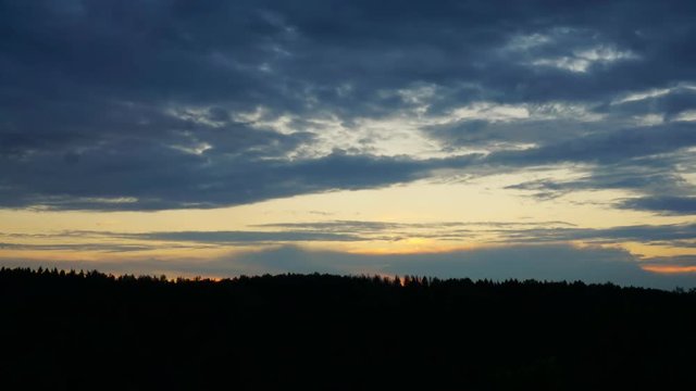 Time lapse of a sunset above a forest