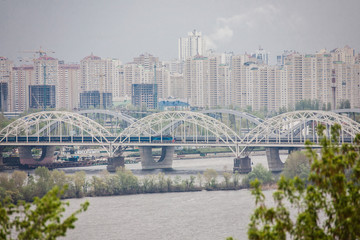 Aerial top view of Paton bridge and Dnieper river from above, city of Kiev