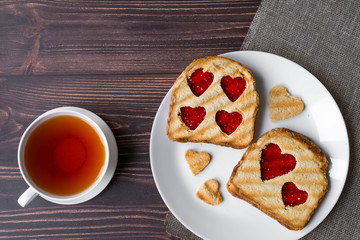 Grilled toast with raspberry jam and tea