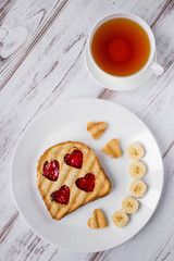 Grilled toast with raspberry jam and tea