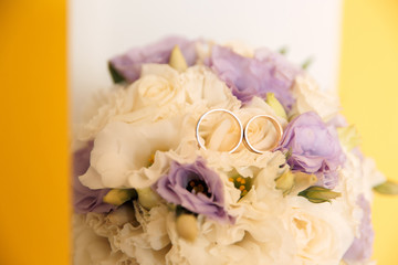 Wedding rings on a eustoma bucket