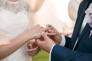 Couple holding hands during wedding ceremony - 185927030