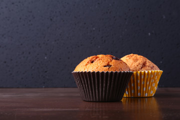 Tasty chocolate cupcakes, muffins on a white wooden table