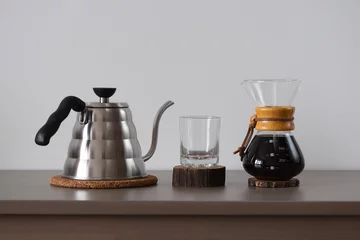 Keuken spatwand met foto Drip coffee set. Steel kettle, glass and hand drip coffee maker minimalistic style © alexeyborodin