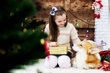 child and dog open New Year's gift