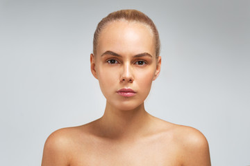 Pretty female model with natural makeup, studio portrait