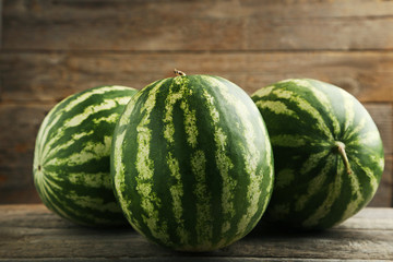 Watermelons on grey wooden table