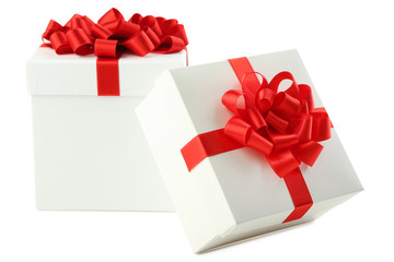 White gift boxes with ribbon isolated on white