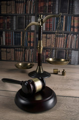  law theme, mallet of the judge, justice scale, old books, wooden desk