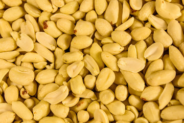 Texture of peeled roasted peanuts for the background
