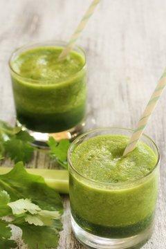 Green Smoothie with spinach celery cilantro, selective focus