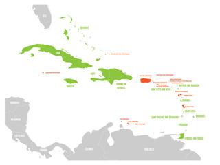Political map of Carribean. Green highlighted sovereign states and orange dependent territories. Simple flat vector illustration.