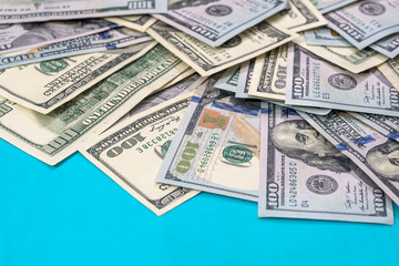 dollar bills isolated on blue background