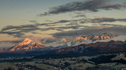 Sunset landscape view of High Tatra mountains with snow during spring in Slovakia from Zakopane, Poland