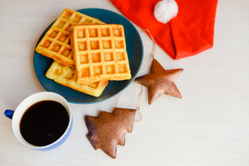 Top side view of delicious homemade waffles with a Christmas theme. Classic culinary styling close up overhead photography