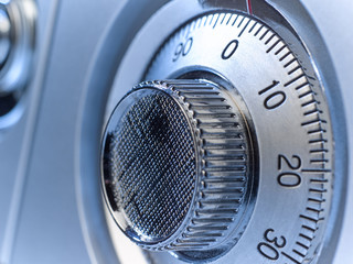 Closeup image of a mechanical safe lock.