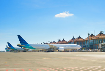 Airplanes at Bali main airport - obrazy, fototapety, plakaty