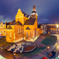 Riga Cathedral or Cathedral of Saint Mary at Cathedral Square during evening blue hour, Doma laukums, Riga, Latvia. Aerial panoramic view