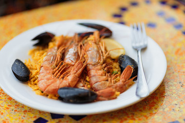 Paella. Rice with king prawns and mussels