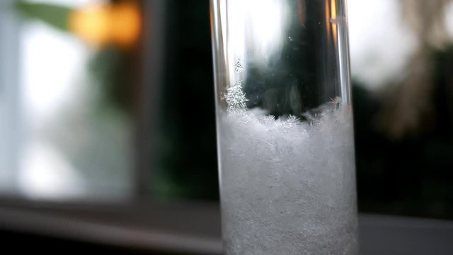 A Storm Glass Temperature Thermometer with Ice crystals signifying cold winter day