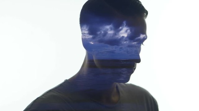 Double exposure of man and sea sunset time-lapse. Double exposition of man and ocean waves