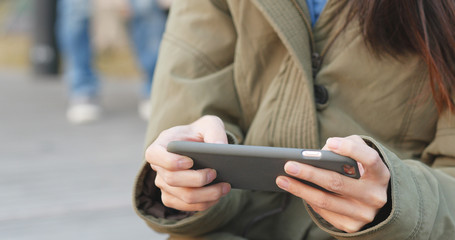 Playing mobile game on cellphone