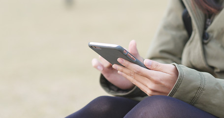 Woman use of mobile phone at outdoor