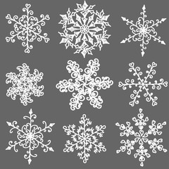 A set of hand-drawn black-and-white snowflake