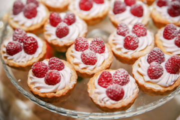 Raspberry cupcake desserts with pink cream
