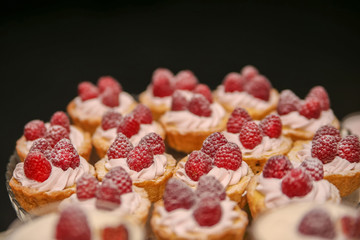 Raspberry cupcake desserts with pink cream

