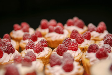 Raspberry cupcake desserts with pink cream
