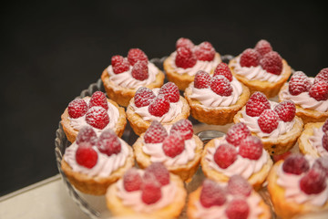 Raspberry cupcake desserts with pink cream

