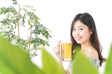 Young woman cracking a beer in beer garden