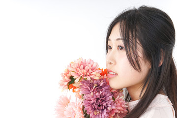 Young woman having flower bouquet