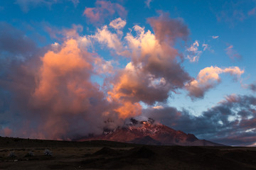 Reddish and purple clouds with blue sky