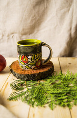 Tea in a green cup on a Christmas table