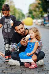 beautiful young family with ice cream