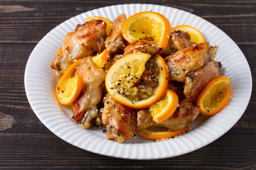 Orange chicken wings with sesame seeds, horizontal