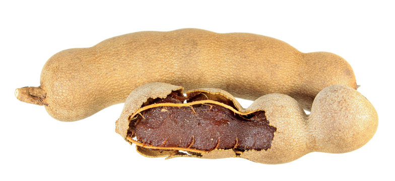Group of raw tamarind fruits isolated on white background