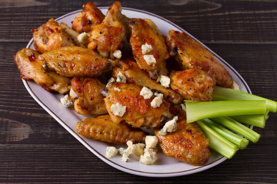 Chicken wings buffalo with blue cheese and celery sticks, horizontal