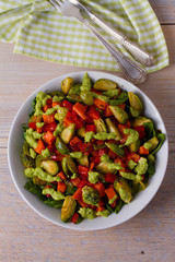 Roasted vegetable salad with avocado dressing. View from above, top, vertical