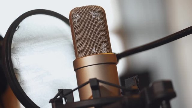Music studio recording, view of studio microphone, music equipment.

