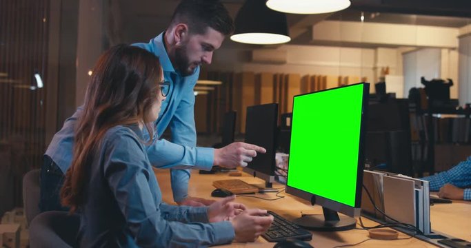 Diverse group multiracial colleagues professionals brainstorming together while discussing a project on computer screen. Green screen chroma key. 4K UHD
