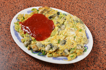 Oyster omelet,famous snack food at night market in Taiwan.