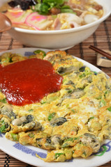 Oyster omelet,famous snack food at night market in Taiwan.