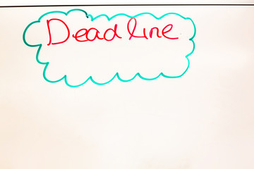 Dead line wording written on white board in the office