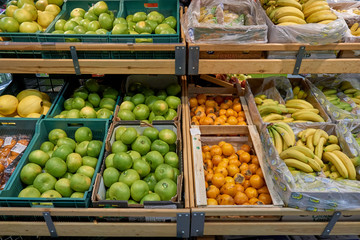 Fresh appetizing fruit on the counter in the store