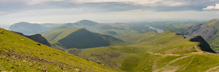 Walking down from Mount Snowdon on the Llanberis Path, Snowdonia, Gwynedd, Wales, UK - looking...